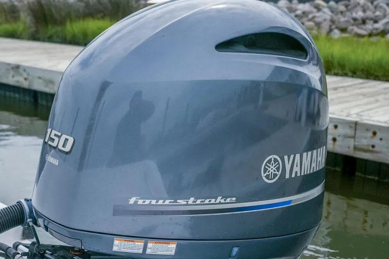 Slide: The Image of Yamaha 150 four-stroke outboard motor on 2019 Sportsman Open 212 Center Console boat. - 16