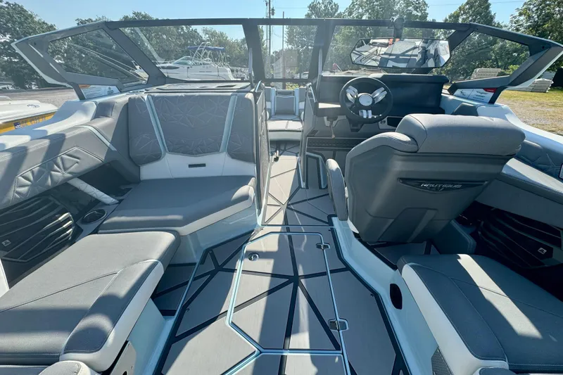 Slide: The Image of 2026 Nautique Super Air Nautique G23 Paragon interior with luxurious seating and modern dashboard. - 11
