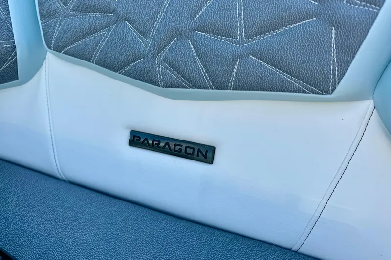 Slide: The Image of 2026 Nautique Super Air Nautique G23 Paragon interior with stylish stitching and Paragon logo. - 14