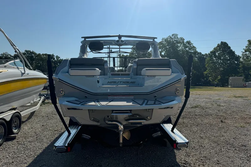 Slide: The Image of 2026 Nautique Super Air Nautique G23 Paragon boat, rear view in outdoor setting. - 8