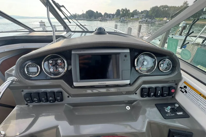 Slide: The Image of Control panel of a 2012 Regal 28 Express boat with navigation system. - 14