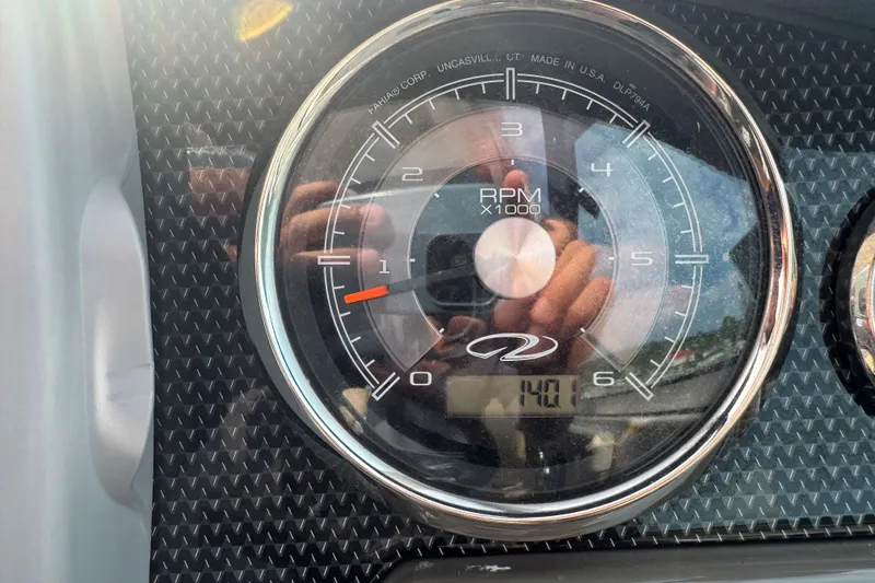 Slide: The Image of Close-up of 2012 Regal 28 Express tachometer showing RPM and reflections. - 15