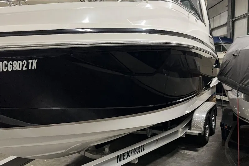 Slide: The Image of 2012 Regal 28 Express boat on trailer in indoor storage facility. - 6