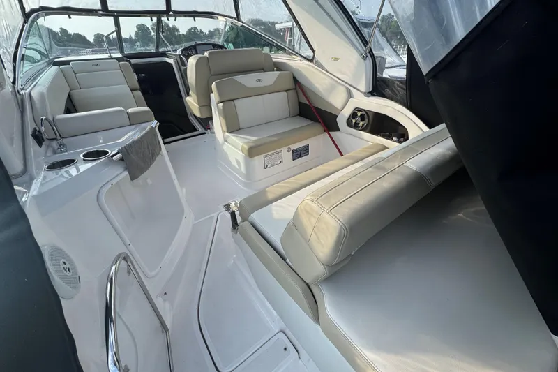 Slide: The Image of 2012 Regal 28 Express boat interior with white seating and modern design. - 7