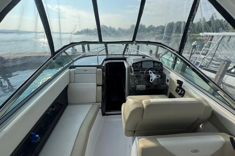 Slide: The Image of Interior view of 2012 Regal 28 Express boat with helm and seating area. - 8