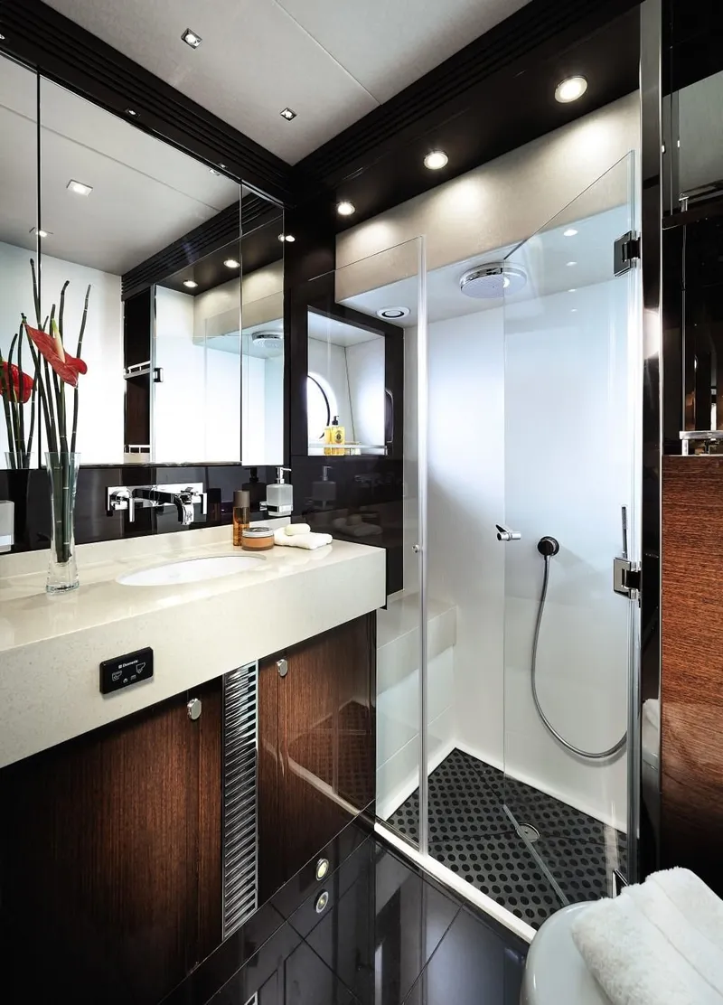 Slide: The Image of Luxurious bathroom in 2014 Sunseeker Predator 68 yacht, featuring modern fixtures and elegant design. - 13