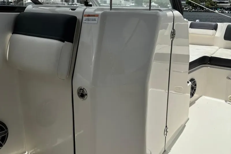 Slide: The Image of 2020 Bayliner DX2200 boat interior with seating and storage compartment. - 7