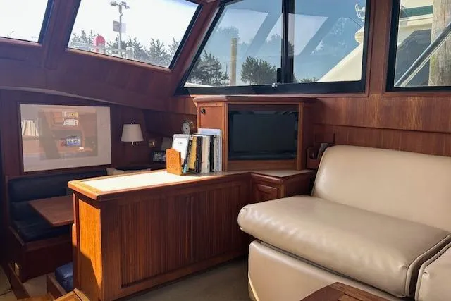 Slide: The Image of Interior of 1988 Viking 45 Convertible yacht with wood paneling and leather seating. - 10