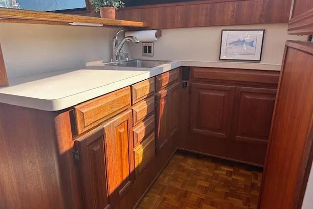 Slide: The Image of 1988 Viking 45 Convertible yacht kitchen with wooden cabinets and countertop. - 14