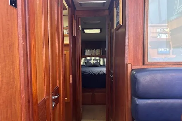 Slide: The Image of Interior view of 1988 Viking 45 Convertible yacht with wooden paneling and cozy cabin. - 17