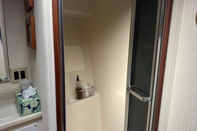 Slide: The Image of 1988 Viking 45 Convertible yacht bathroom with shower and sink area. - 18