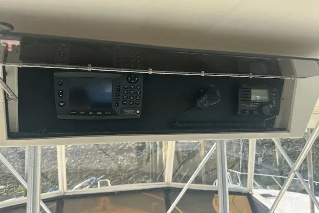 Slide: The Image of 1988 Viking 45 Convertible boat dashboard with navigation and communication equipment. - 29