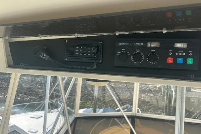 Slide: The Image of Control panel of a 1988 Viking 45 Convertible boat with communication equipment. - 30
