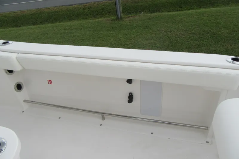 Slide: The Image of 2026 Robalo R222 Center Console boat interior with white seating and stainless steel rail. - 12