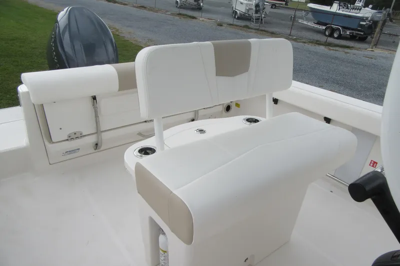 Slide: The Image of 2026 Robalo R222 Center Console boat interior with seating and storage features. - 16