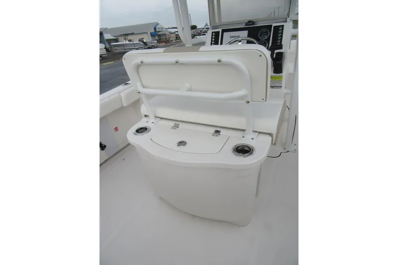 Slide: The Image of 2026 Robalo R222 Center Console boat interior with helm and seating area. - 17