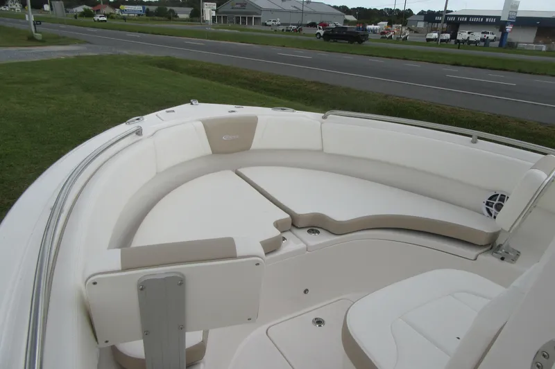 Slide: The Image of 2026 Robalo R222 Center Console boat interior with cushioned seating and sleek design. - 5