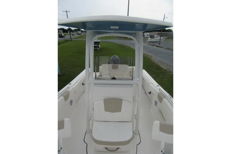 Slide: The Image of 2026 Robalo R222 Center Console boat interior with seating and console view. - 7