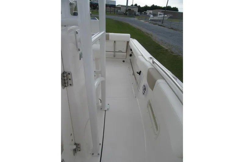 Slide: The Image of 2026 Robalo R222 Center Console boat interior, showcasing spacious deck and seating area. - 9
