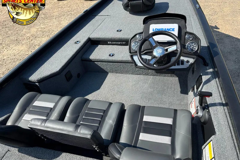 Slide: The Image of 2024 Ranger RT178 boat interior with steering wheel and seating, featuring Lowrance electronics. - 6
