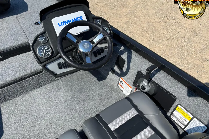 Slide: The Image of 2024 Ranger RT178 boat cockpit with steering wheel, Lowrance electronics, and control panel. - 8