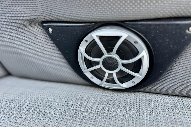 Slide: The Image of Close-up of a speaker on a 2023 Regency 250 LE3 boat seat. - 19