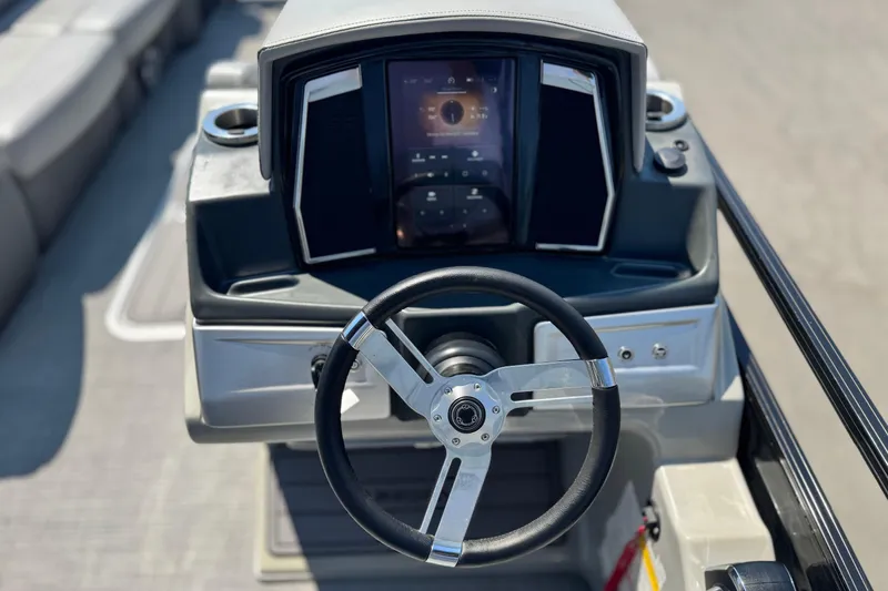 Slide: The Image of Steering console of 2023 Regency 250 LE3 boat with modern dashboard display. - 22