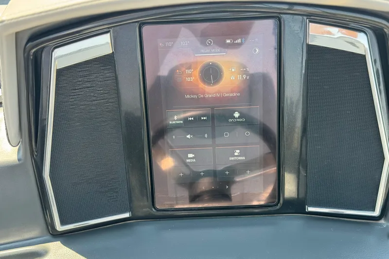 Slide: The Image of 2023 Regency 250 LE3 dashboard with touchscreen display and audio controls. - 23