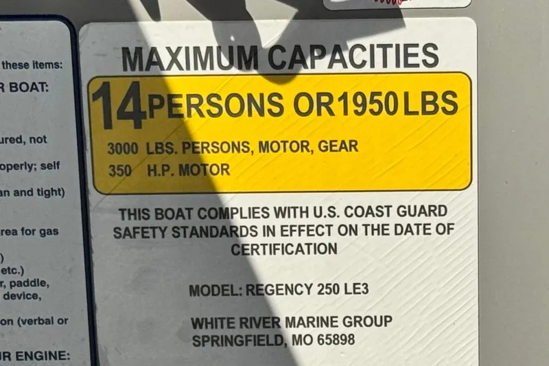 Slide: The Image of 2023 Regency 250 LE3 boat capacity label: 14 persons or 1950 lbs, 350 HP motor. - 27