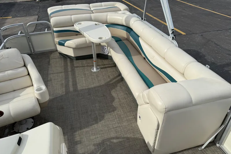 Slide: The Image of 2001 Bennington 2550 RL pontoon boat with spacious seating and table on deck. - 15