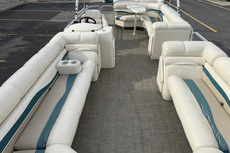 Slide: The Image of 2001 Bennington 2550 RL pontoon boat with spacious seating and elegant interior design. - 21