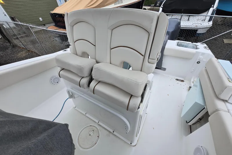 Slide: The Image of 2020 Sea Hunt Gamefish 25 boat with dual cushioned seats and white interior. - 21