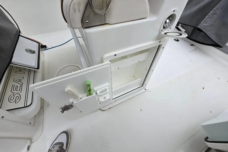 Slide: The Image of 2020 Sea Hunt Gamefish 25 boat interior with open storage compartment and seating. - 22