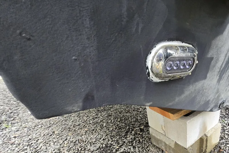 Slide: The Image of Close-up of 2020 Sea Hunt Gamefish 25 hull with mounted underwater light. - 28