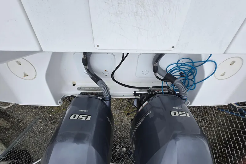 Slide: The Image of 2020 Sea Hunt Gamefish 25 with dual Yamaha 150 outboard motors, rear view. - 29