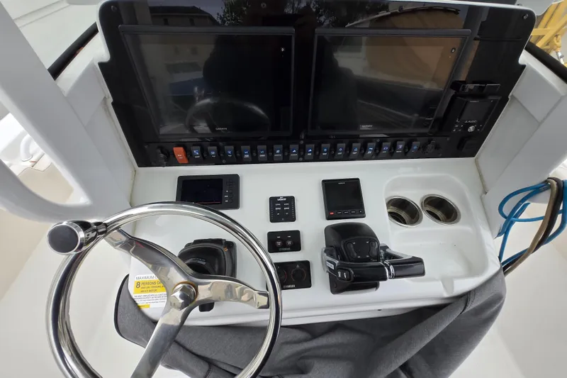 Slide: The Image of 2020 Sea Hunt Gamefish 25 helm with dual displays and controls. - 4