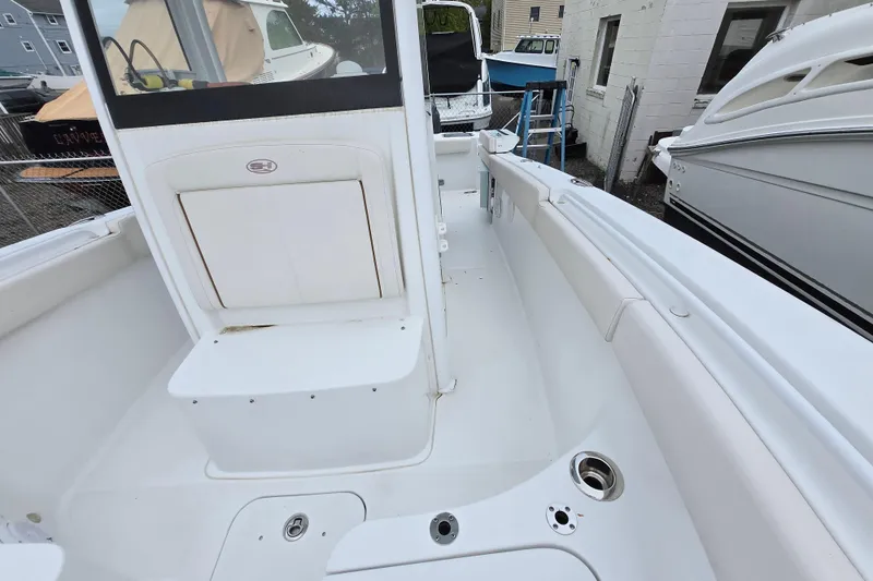 Slide: The Image of 2020 Sea Hunt Gamefish 25 boat interior, featuring spacious seating and storage compartments. - 9