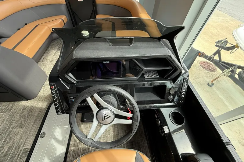 Slide: The Image of Interior view of 2025 Viaggio Lago X-D boat cockpit with steering wheel and seating. - 6