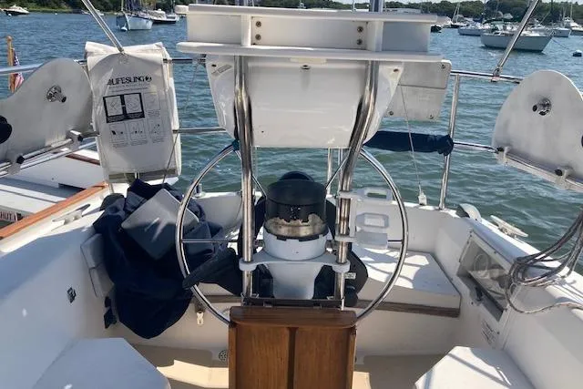 Slide: The Image of Cockpit of 1987 Catalina 30 MK II sailboat with steering wheel and navigation equipment. - 10