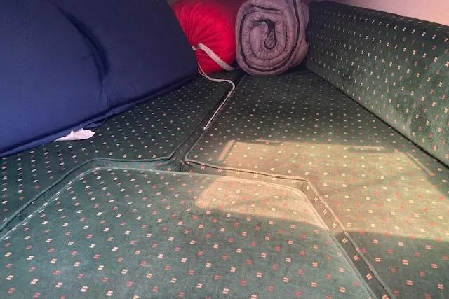 Slide: The Image of Interior cabin of 1987 Catalina 30 MK II with green patterned cushions. - 5