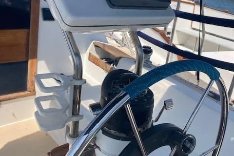 Slide: The Image of 1987 Catalina 30 MK II sailboat cockpit with steering wheel and navigation instruments. - 9