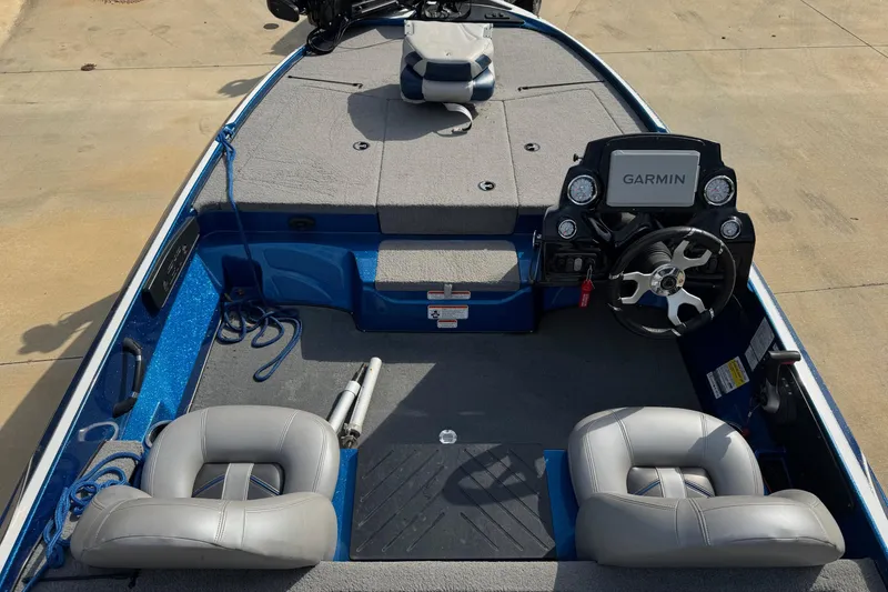 Slide: The Image of 2023 Nitro Z17 boat interior with Garmin navigation system and gray seating. - 3