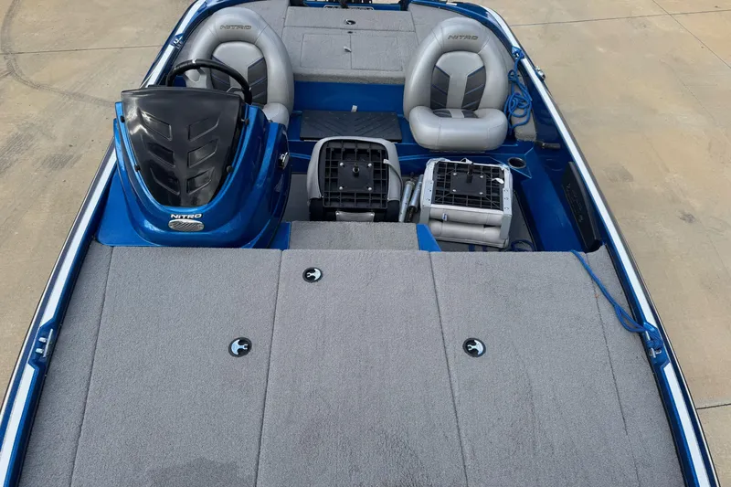 Slide: The Image of 2023 Nitro Z17 boat interior with gray seating and storage compartments. - 5