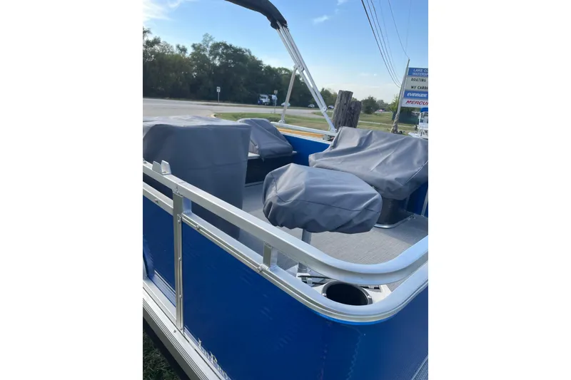 Slide: The Image of 2026 Paddle King Lo Pro Angler boat storage compartment open, showcasing interior space. - 6