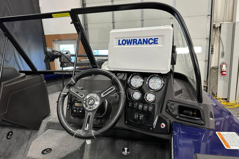 Slide: The Image of 2023 Tracker TARGA boat dashboard with Lowrance HDS system and gauges. - 12