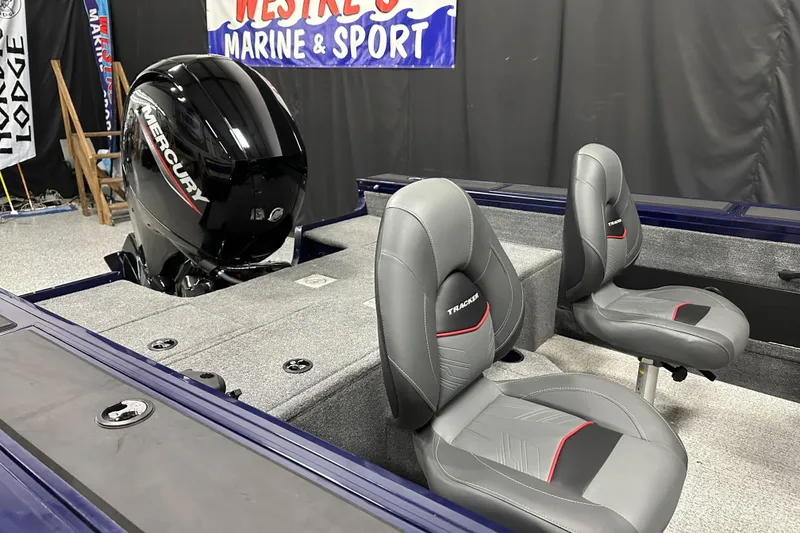 Slide: The Image of 2023 Tracker TARGA boat interior with Mercury engine and gray seating. - 14