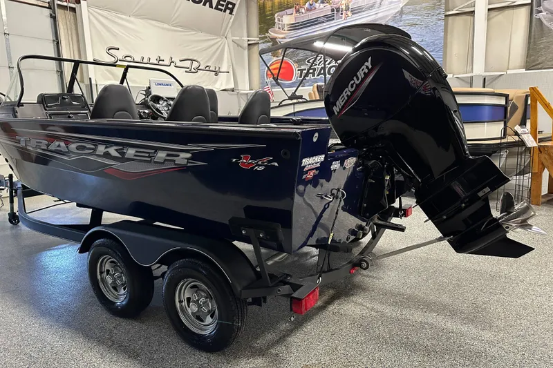 Slide: The Image of 2023 Tracker TARGA boat with Mercury engine on trailer in showroom. - 4