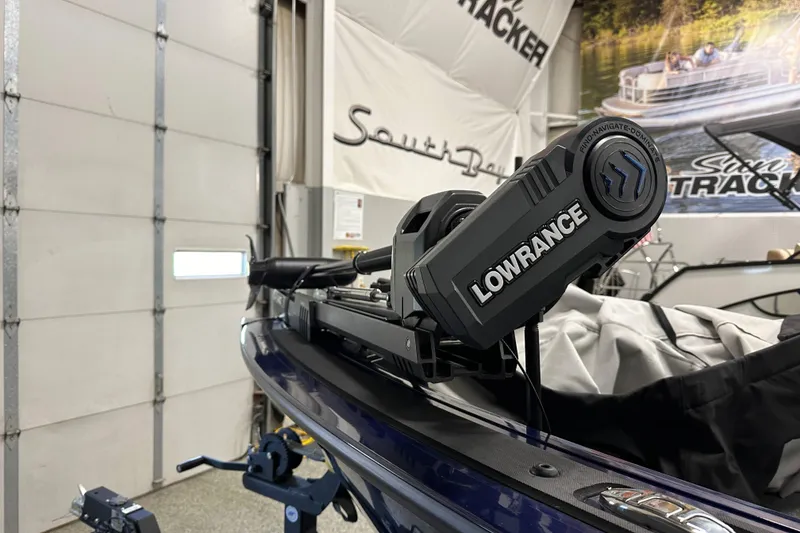 Slide: The Image of 2023 Tracker TARGA boat with Lowrance equipment in a showroom setting. - 9