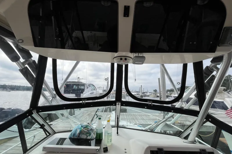 Slide: The Image of Interior view of 2004 Grady-White Gulfstream 232 boat at a marina dock. - 15