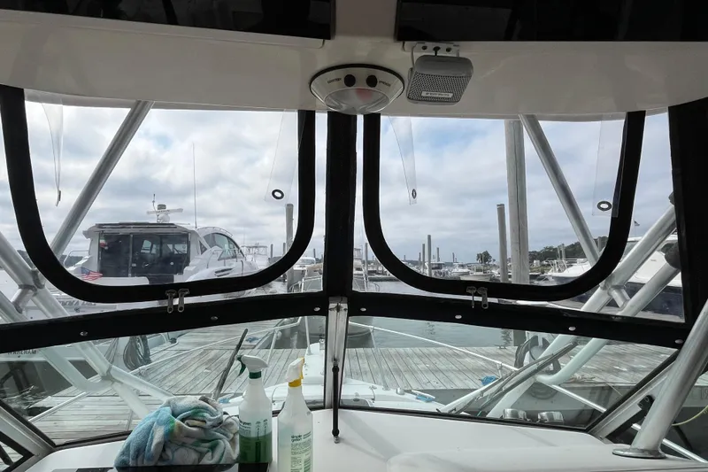 Slide: The Image of Interior view from a 2004 Grady-White Gulfstream 232 boat at a marina. - 18